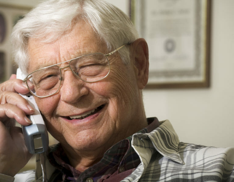 senior man talking on telephone