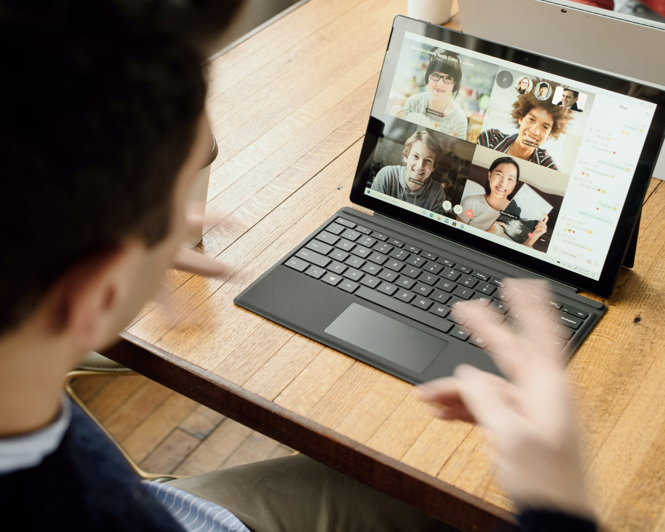 a man taking part in a group video call