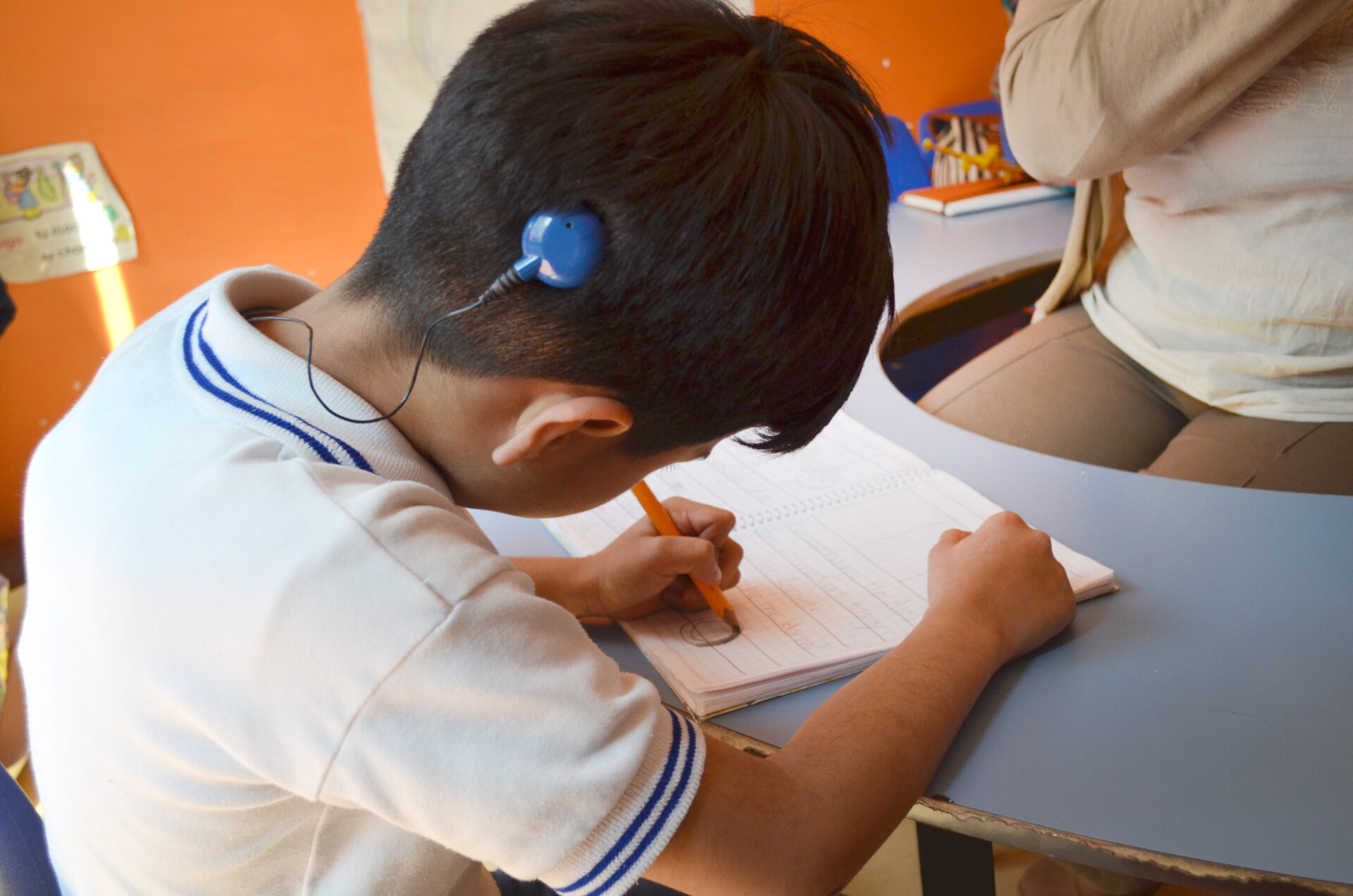 Deaf,Boy,With,Cochlear,Implant,Studying