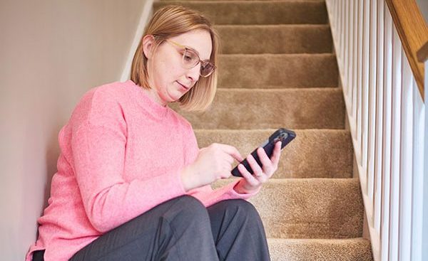 Members - Marta RE22-709 - texting - text message - Stairs - Hampton - Low res - 2024 Deafblind_UK542