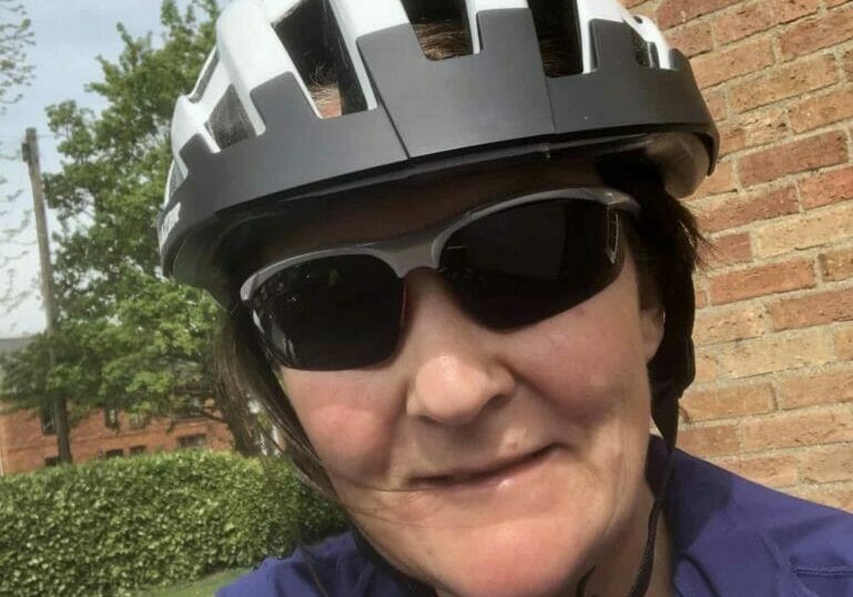 Jo in her bike helmet and sunglasses